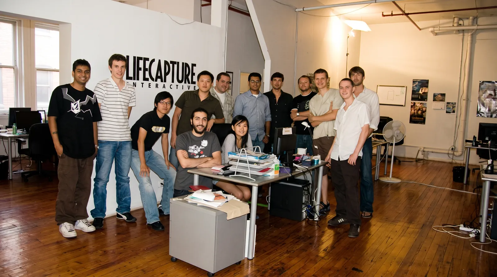 The early Lifecapture Interactive team gathered in the studio at 263 Adelaide Street West, Toronto, under the company logo